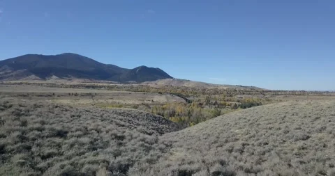 Wild Undulating Landscape with Tree Covered Mountains, Aerial Drone Shot Stock Footage 281768271