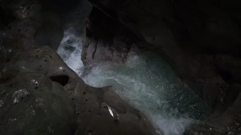 Wild water stream through washed out rocks in slow-motion Stock Footage 218356019