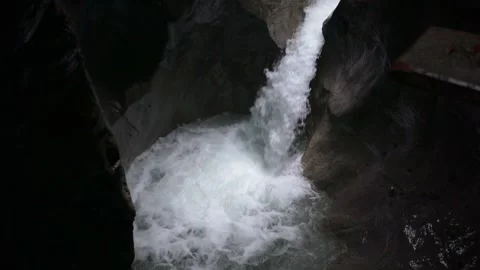 Wild water stream with waterfall through washed out rocks in slow-motion Stock Footage 218356493