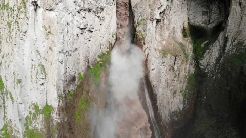 Wild Waterfall Carving Rugged Cliffs. Vast Rushing Water Erodes Limestone Stock Footage 339364993
