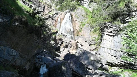 A wild waterfall in the mountains 스톡 동영상 219363389