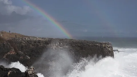 Wild waves breaking in the atlantic coast with rainbow in slow-mo Stock Footage 88529699