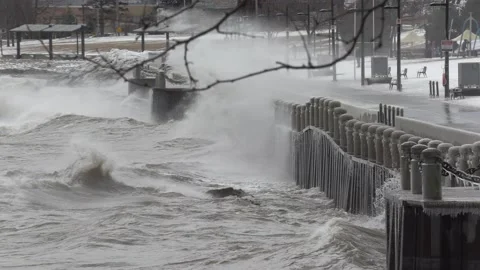Wild waves breaking crashing into shore in hurricane force wind storm Stockbeeldmateriaal 147639100