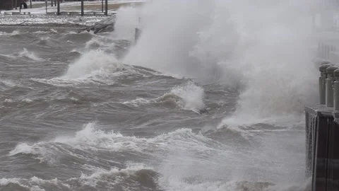 Wild waves breaking crashing into shore in hurricane force wind storm Stock-Footage 147642111