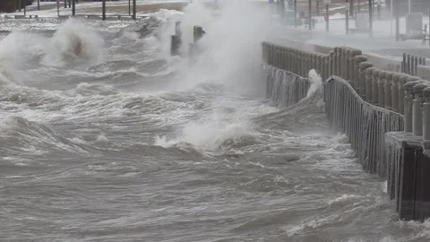 Wild waves breaking crashing into shore in hurricane force wind storm 動画素材 147642572