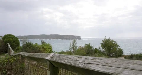 Wild winds and rough waves smash on the cliffs of sydney coast in slow motio Stock Footage 137624152