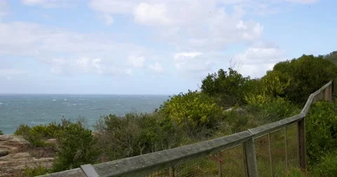 Wild winds and rough waves smash on the cliffs of sydney coast in slow motio Stock Footage 137624177