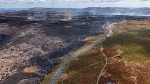 Wildfire Aftermath and Smoke Whirl on Llangynidr Moors, Aerial Drone Shot Stock-Footage 343402842
