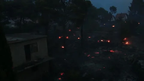 Wildfire around the houses night sequence Stock Footage 133948717