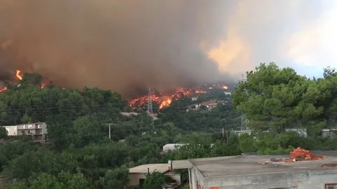 Wildfire around the houses sequence Stock Footage 133948215
