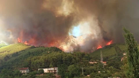 Wildfire around the village sequence Stock Footage 133948158