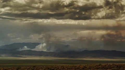 A wildfire burns within a vast valley in the Great Basin desert in Nevada. Stock Footage 235585704