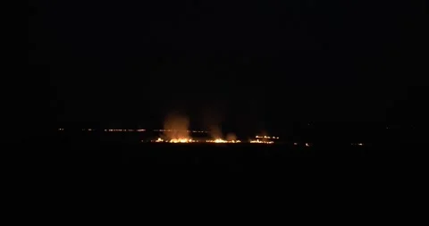 Wildfire at night. Flames burning in grass fire in slow motion. Stock Footage 275014851