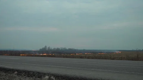 Wildfire occuring on a field Stock Footage 92386196