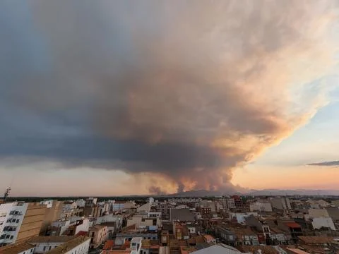 Wildfire producing massive smoke plume over almassora city Stock Photos