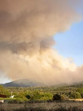 Wildfire smoke cloud over a rural castropodame landscape Фото