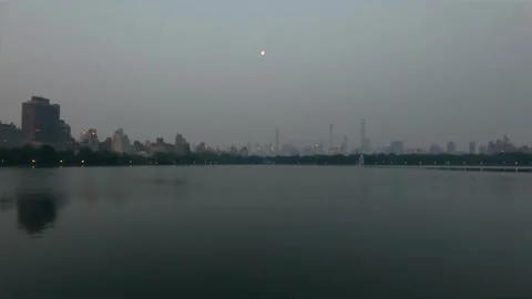 Wildfire smoke leaves a layer of haze and smog over New York city skyline Stock Footage 243188136