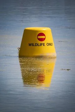 Wildlife only buoy designating protected area Stock Photos