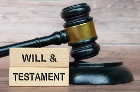 Will and testament text engraved on wooden blocks with lawyer gavel backgroun Stock Photos