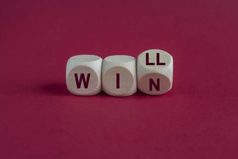 Will to win symbol. Turned a cube and changes red words will to win. Foto stock