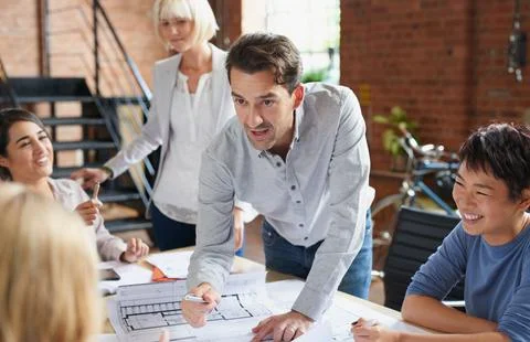 Will you be able to take on the task. a group of architects working with Stock Photos
