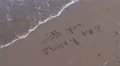 Will you marry me written in sand washed away by wave HD Footage