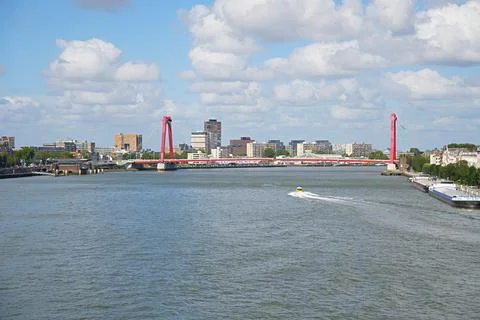 The Willemsbrug cable-stayed bridge with bright red pylons across the Nieuw.. Stock Photos