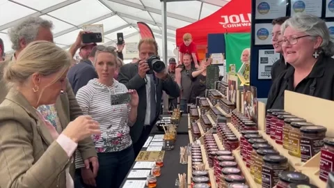 William and Sophie sample gin during during rare joint outing Stock Footage 310797491