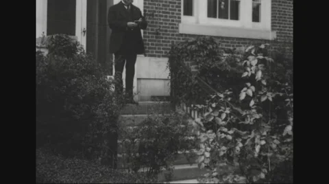 William Cox Redfield stepping out of house Stock Footage