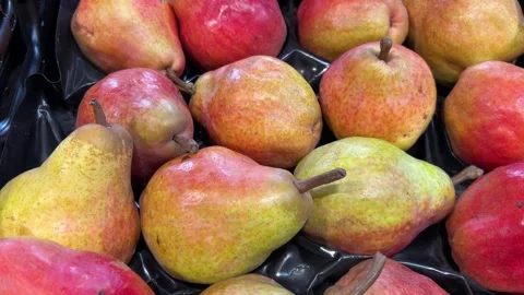 Williams pears on display at the greengrocer's Stock Footage 297780524