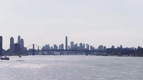 Williamsburg Bridge and Brooklyn Skyline Across East River Stock Footage 346154778