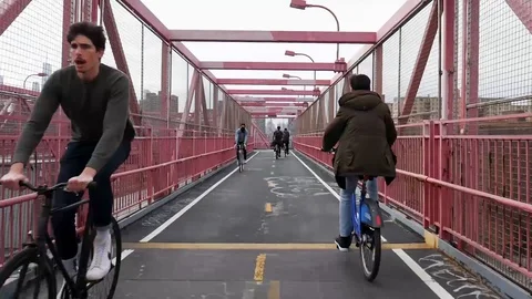 Williamsburg Bridge Bicycle Path New Yorker Commuter Cyclists II Stock Footage 128008406