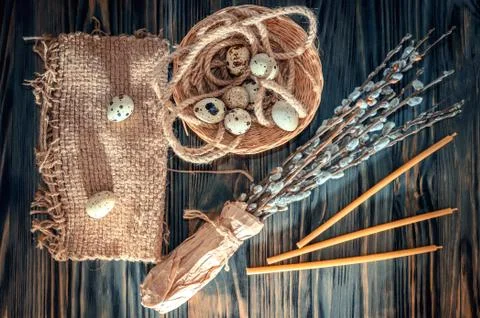 Willow branches and eggs on the table Stock Photos