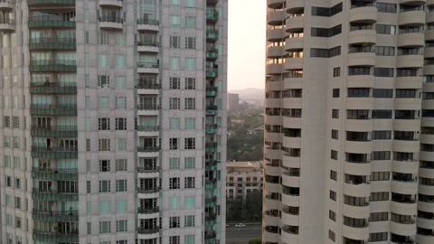 Wilshire Corridor Tower Facades to Rooftop Helipads, Rising Aerial, 4K Stock Footage 145707724