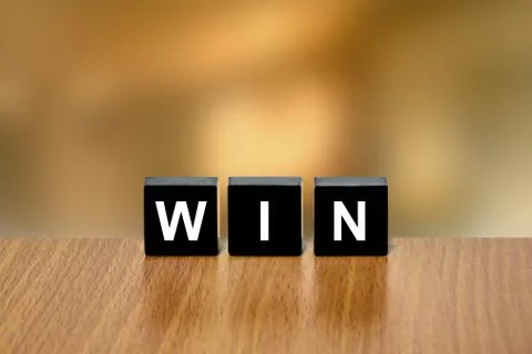 Win on black block Stock Photos