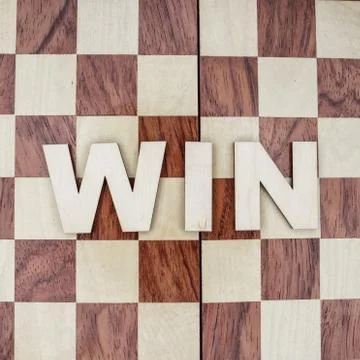 Win concept on wooden background Stock Photos