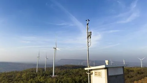 Win measuring device at a windmill power generator farm. Stock Photos