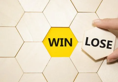 Win or Lose symbol. Concept word Win or Lose on wooden comb puzzle. Businessm Stock Photos