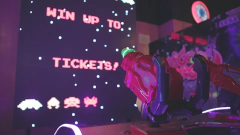 Win tickets at arcade playing Space Invaders game 4k Stock Footage 155213273