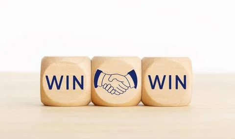 Win Win concept. Text and handshake Icon on wooden blocks. Copy space Win ... Stock Photos