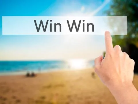 Win Win - Hand pressing a button on blurred background concept on visual scre Stock Photos