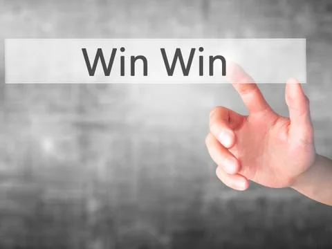 Win Win - Hand pressing a button on blurred background concept on visual scre Stock Photos