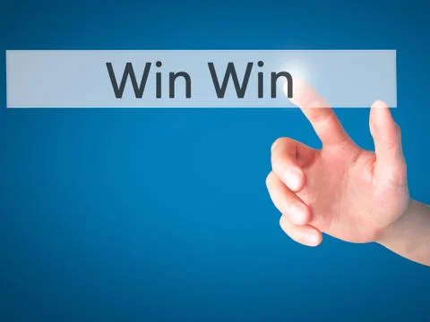 Win Win - Hand pressing a button on blurred background concept on visual scre Stock Photos