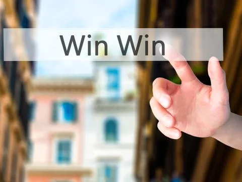 Win Win - Hand pressing a button on blurred background concept on visual scre 스톡 사진