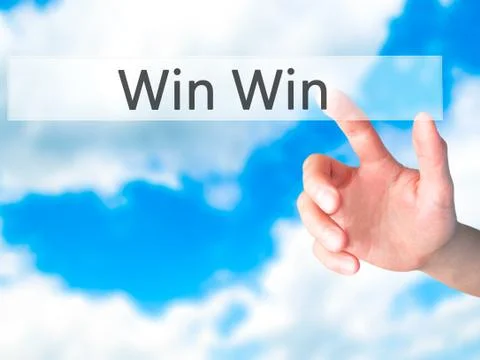 Win Win - Hand pressing a button on blurred background concept on visual scre 写真素材