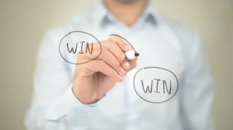Win Win Strategy,  Man writing on transparent screen Stock Footage 62986211
