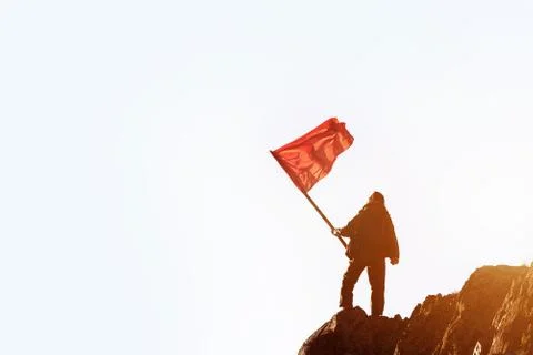 Win winner concept man red flag mountain top Stock Photos
