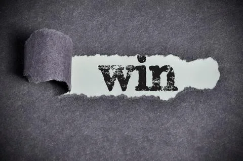 Win  word under torn black sugar paper Foto stock