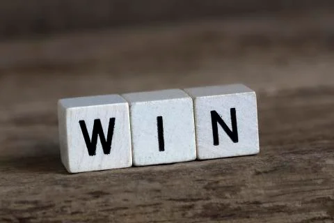 Win, written in cubes Stock Photos