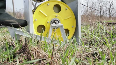 The winch pulls the cable to which the plow is attached. Plowing land on the 库存影片 88921393